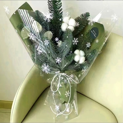 Bom preço. Loja de flores de celófano de flocos de neve impermeáveis de Natal, buquês de flores da véspera de Natal, presentes, fábrica de embalagens de maçãs, venda por grosso e venda direta on-line