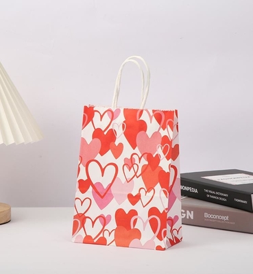 Bom preço. O presente vermelho do papel de embalagem de 80gsm ensaca o papel impresso coração Goodie do amor ensaca com punhos on-line